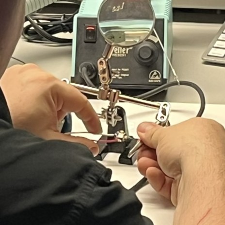 Step 1: Use the helping hands to hold wires in place.
